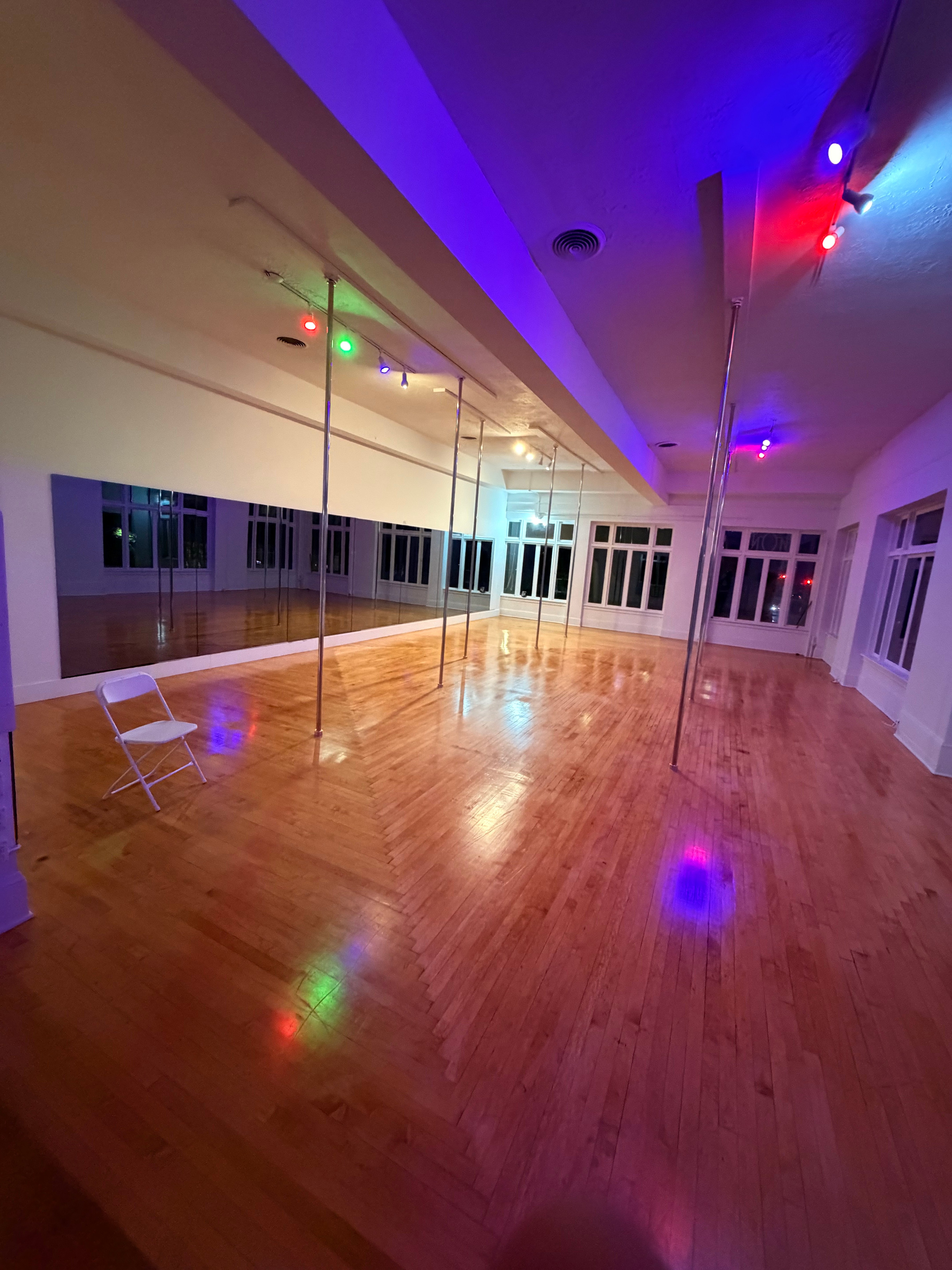 OnDemand Creative Studios movement studio lit with colorful ambient lighting at night